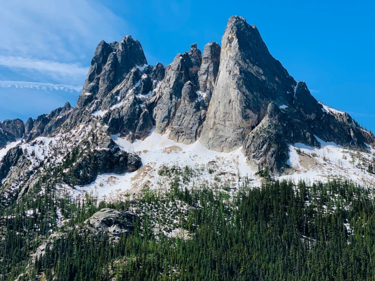 a large mountain with many rocks that have been covered in snow