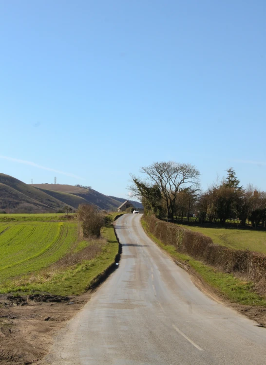 a street in front of an open field