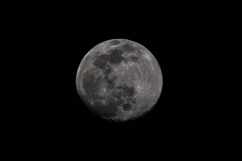 a black and white po of the moon taken with a long lens