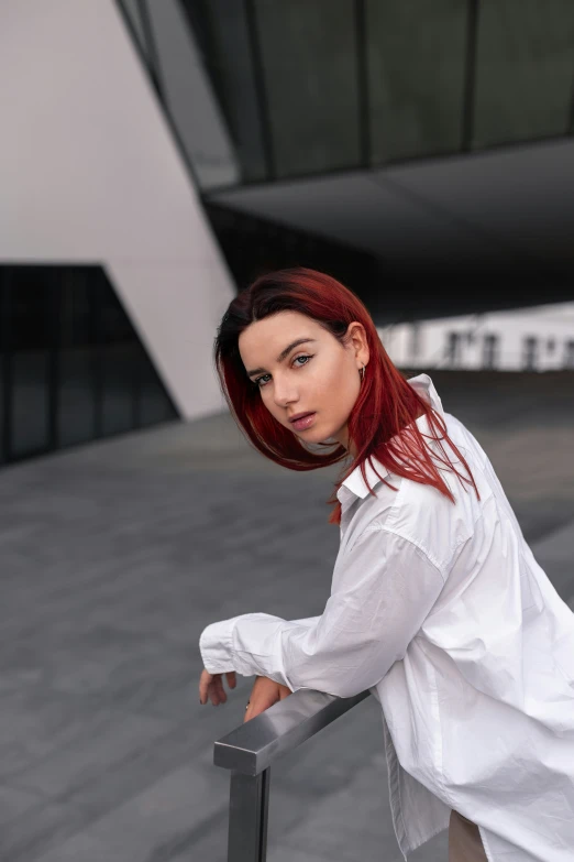 a women who is leaning on a rail