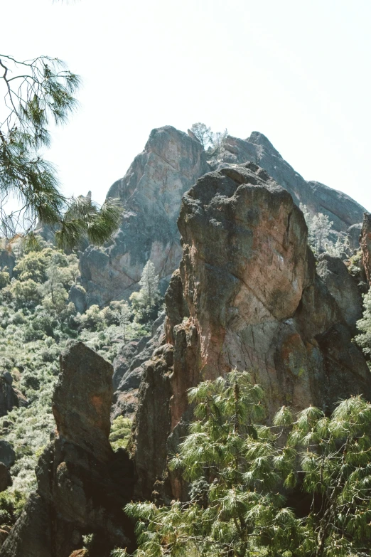 the view from below looking at some rocky mountain tops