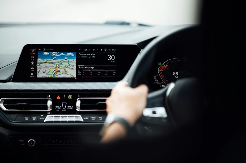 driver's dashboard of car showing the gps and navigation