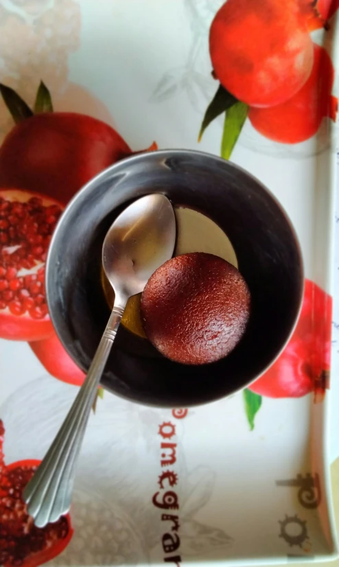 there is a spoon and a plate on this tray