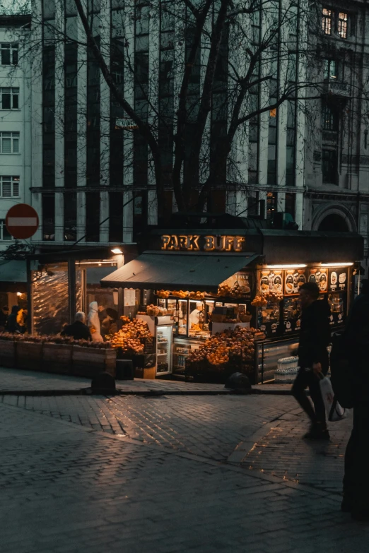 a night view of a small business at an outdoor market