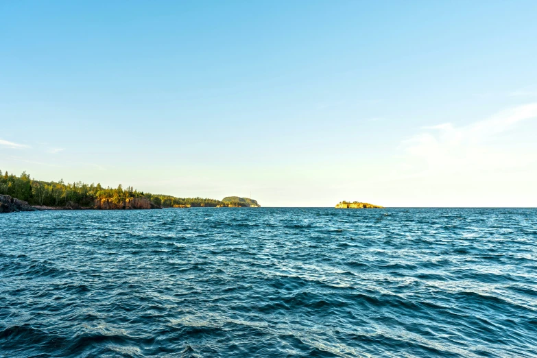 the island is in the distance out on the ocean