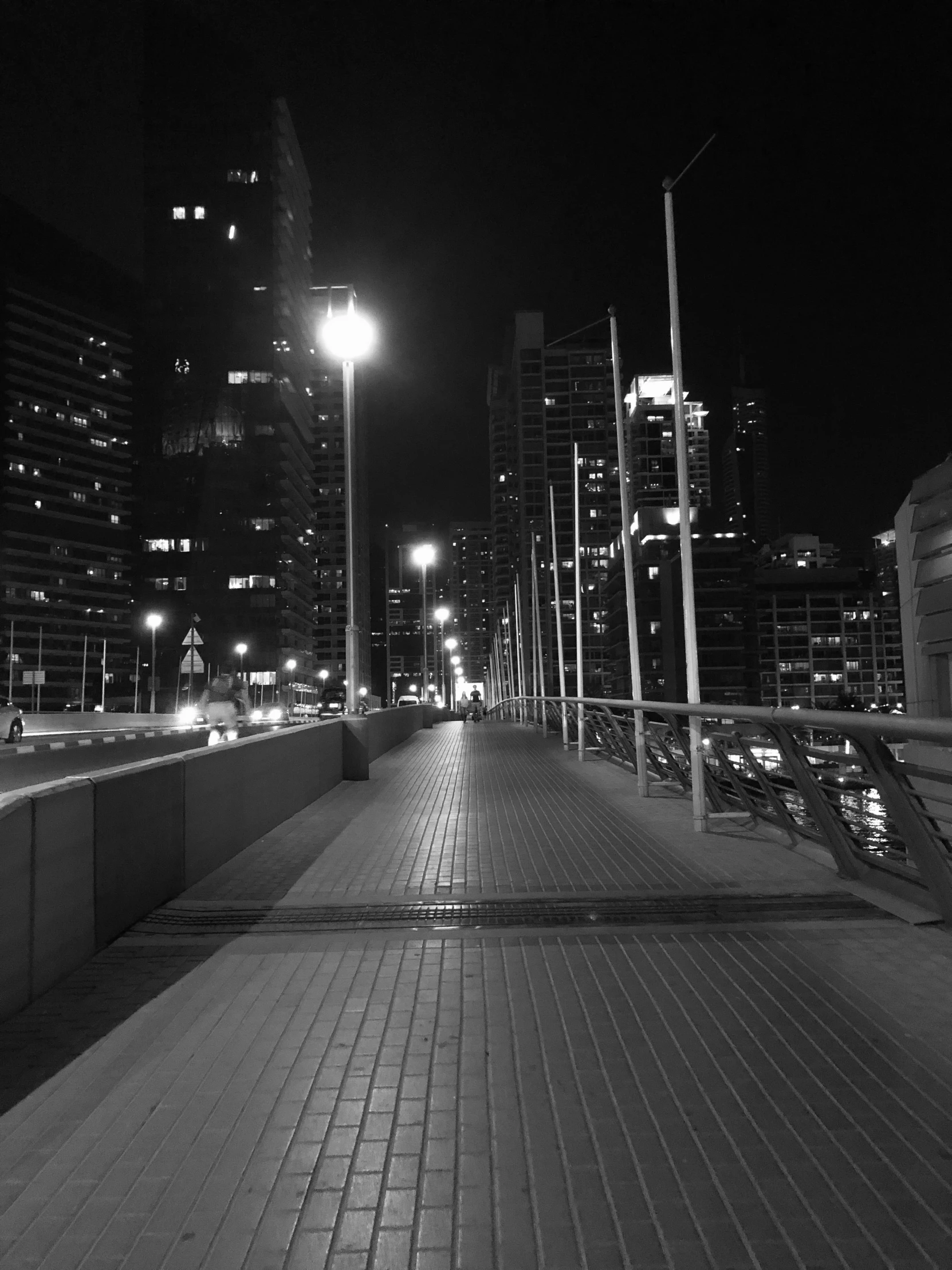 street lights shine brightly above a city's night skyline