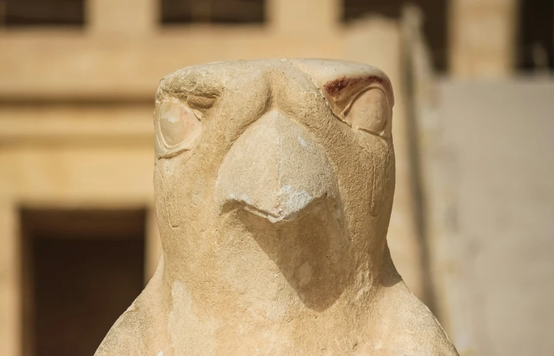 there is a statue with a very unique face