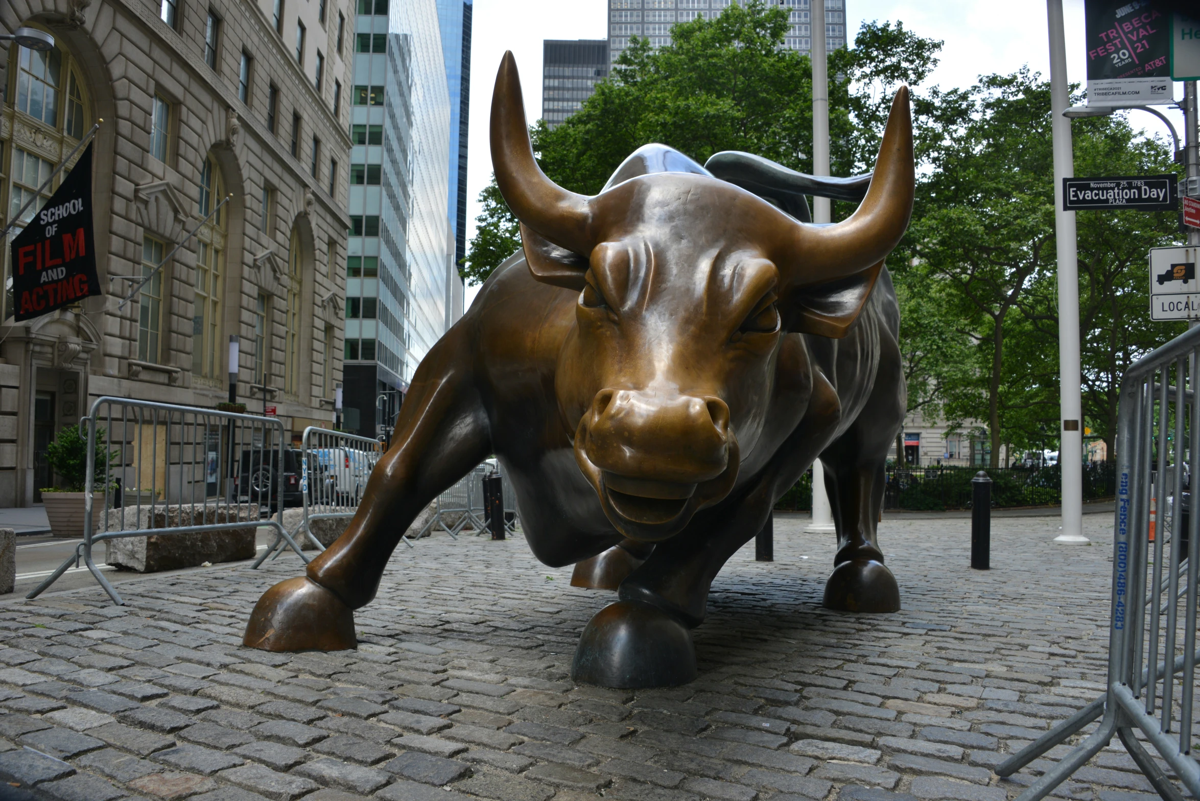 a statue of an ox in a bricked - ground area