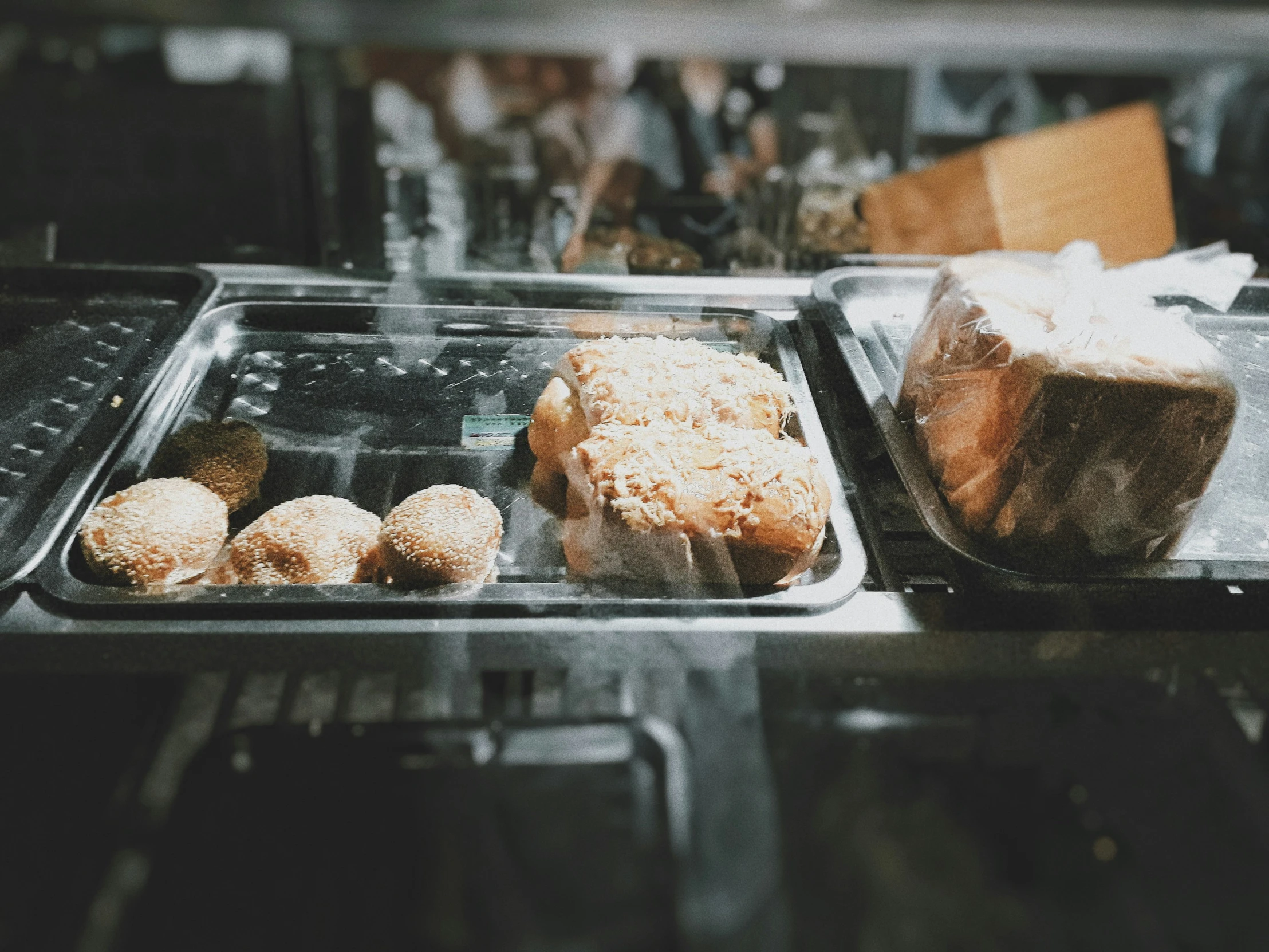 food on trays being served at a bakery