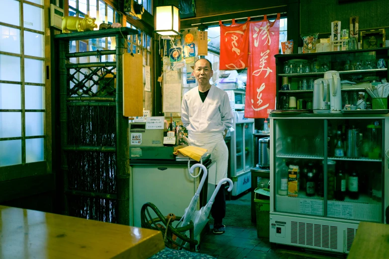 a man that is standing by a counter