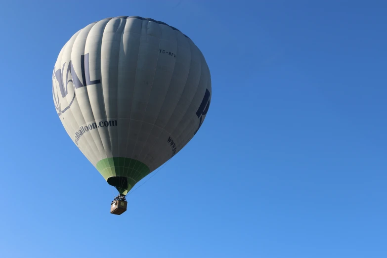 the balloon has the words iam on it and is flying through the sky