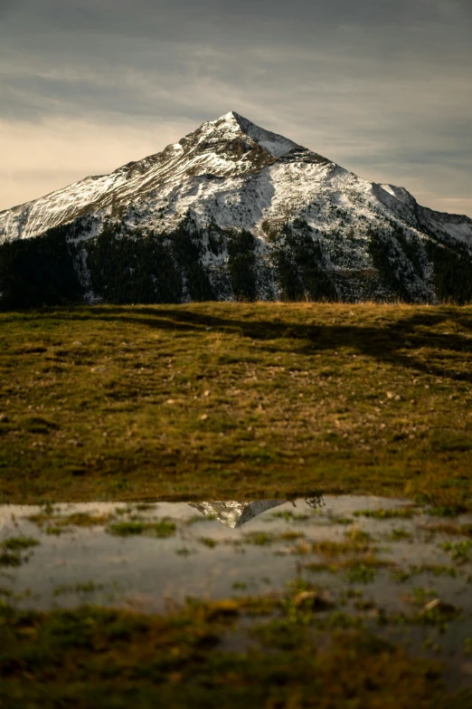 a snow - capped mountain with lots of snow on it