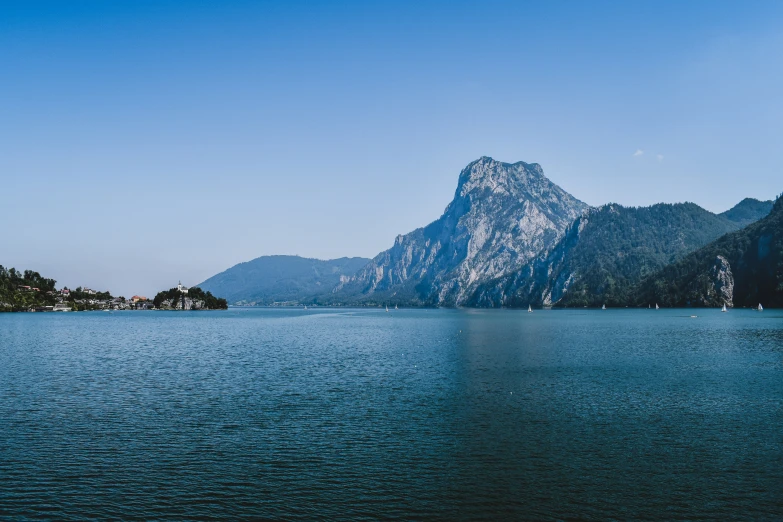 a scenic view of a large mountain from the water