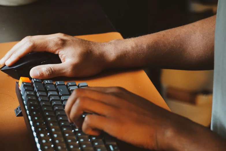 there is a person's hand on top of a mouse