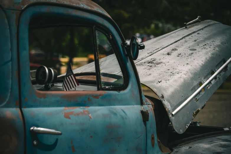 an old truck with a trunk attached to the side