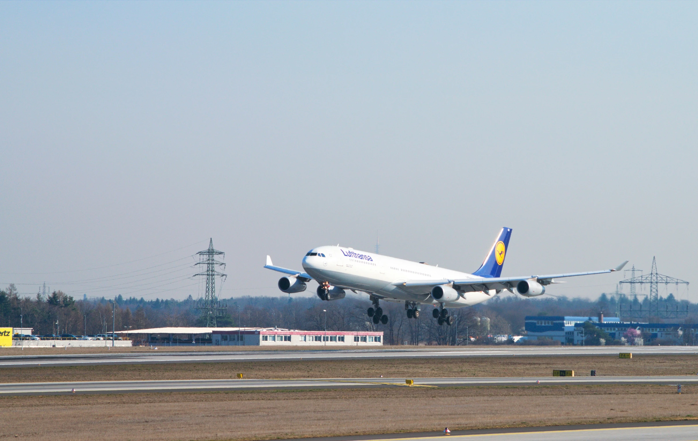 a large airplane is taking off from the runway