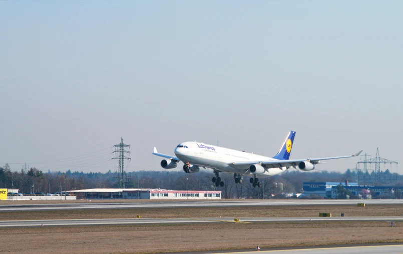 a large airplane is taking off from the runway