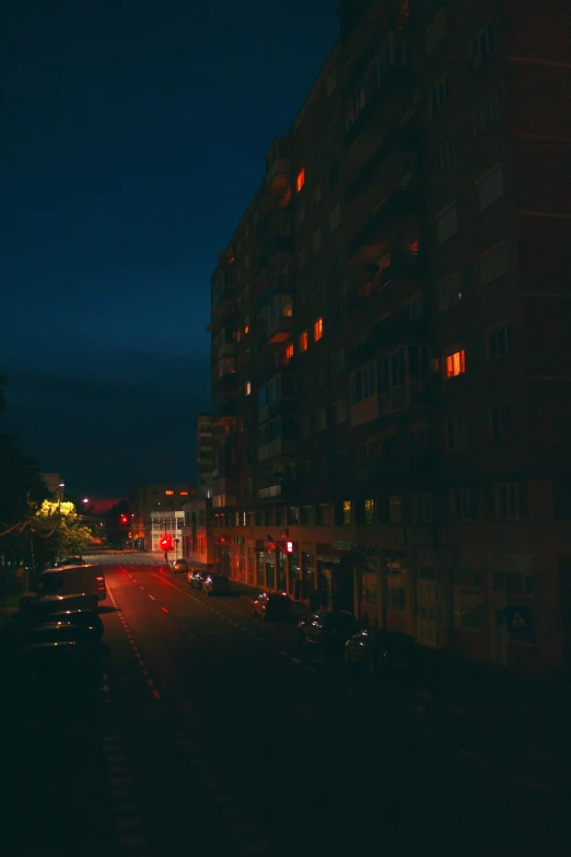 a city street at night with many cars