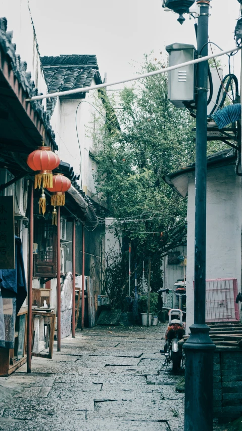 an old street with buildings and asian decorations