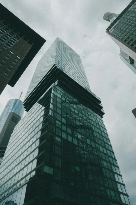 two very tall buildings towering up into the sky