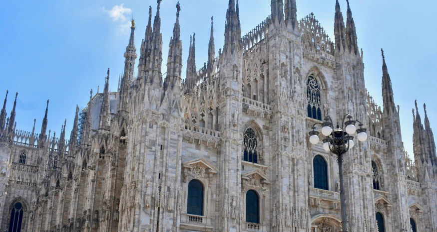 very ornate architecture in the middle of an old gothic city