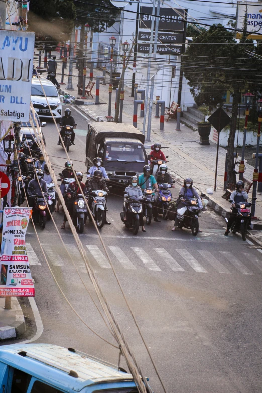 a gang of motorcycle cops riding down the road