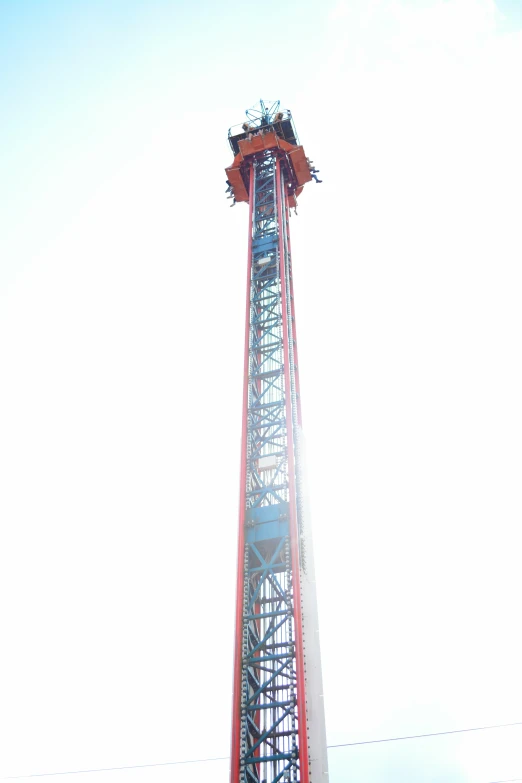 an image of a tower like structure under the sun