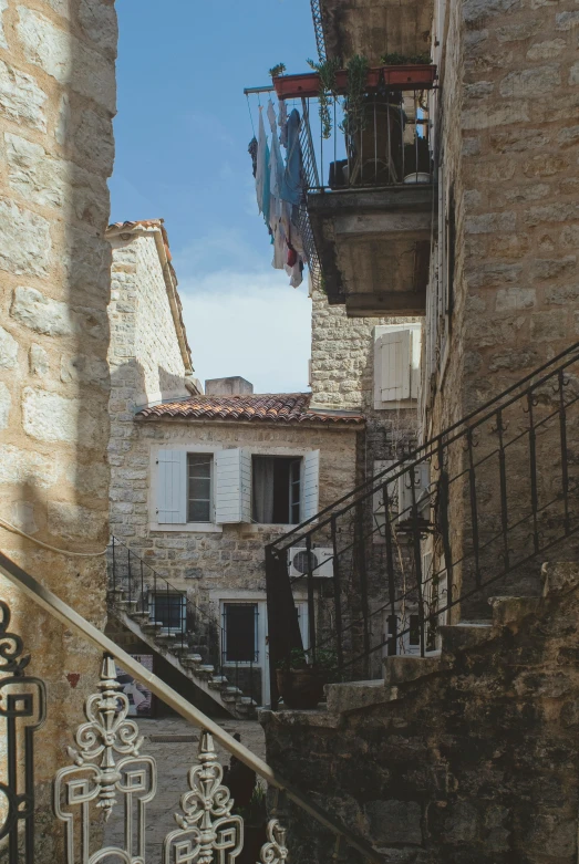 some buildings are seen in the background and there are balconys