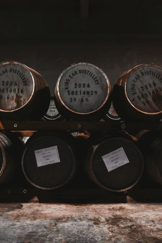 several wooden casks are stacked together