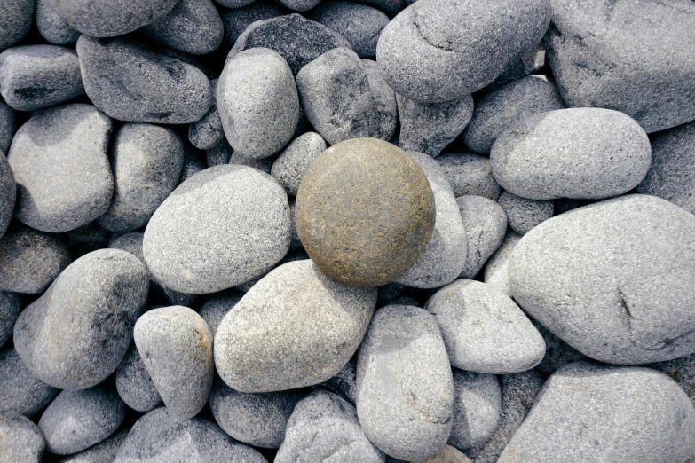 rocks on ground with one rock placed next to the other