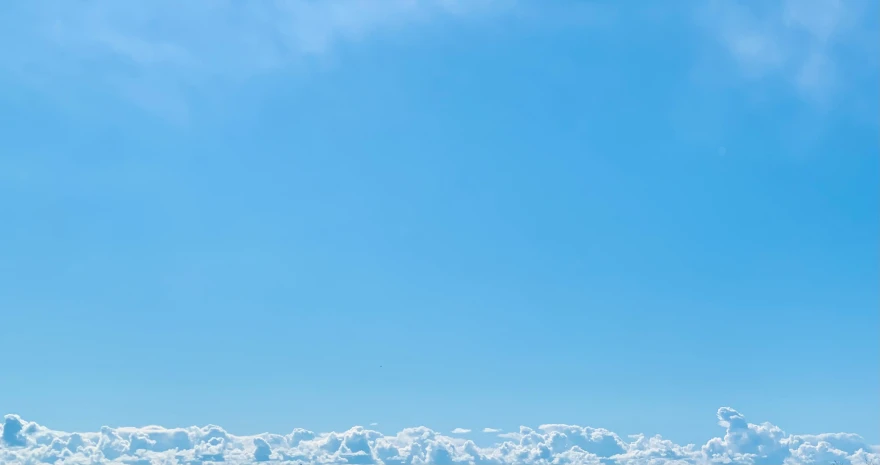 a person in black is snowboarding on some snow