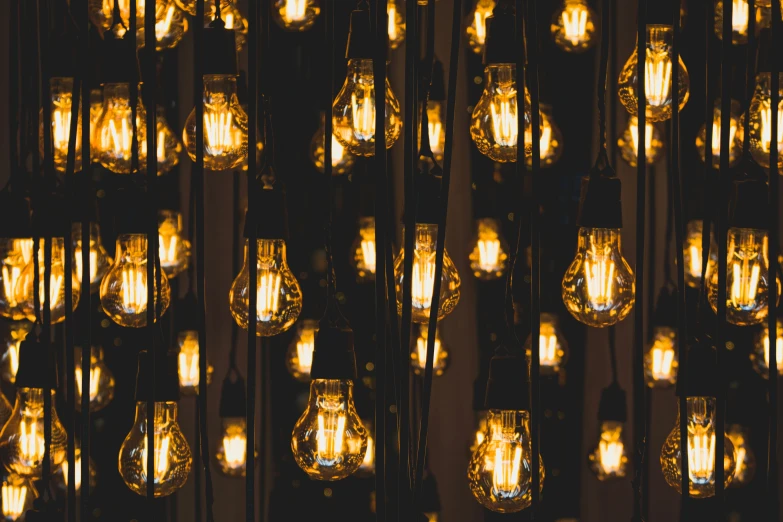 a room filled with lamps with lots of yellow lights