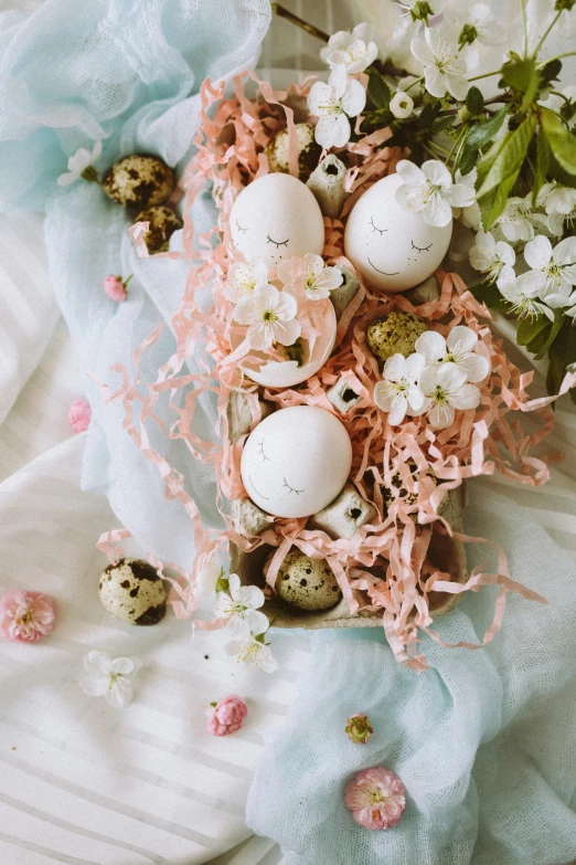 a tray filled with eggs and flowers on a table