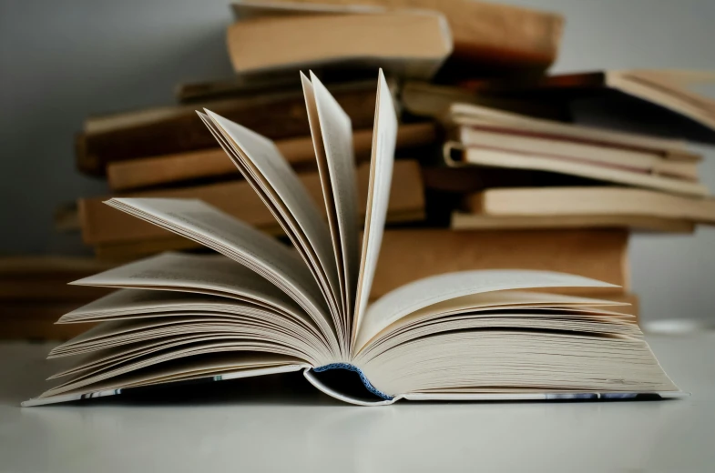 books and stacks of books on the ground