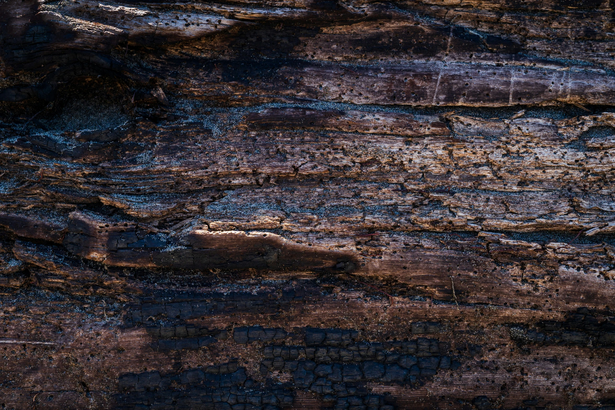 texture of brown rock that has been cut down by the wind