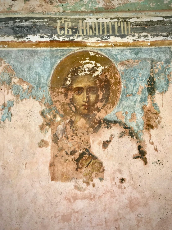 an icon is on the wall of an old church