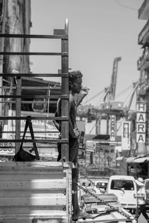 a person standing on a platform near some trucks