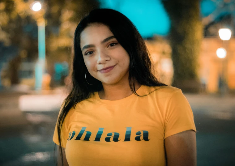 a girl is posing for a picture at night