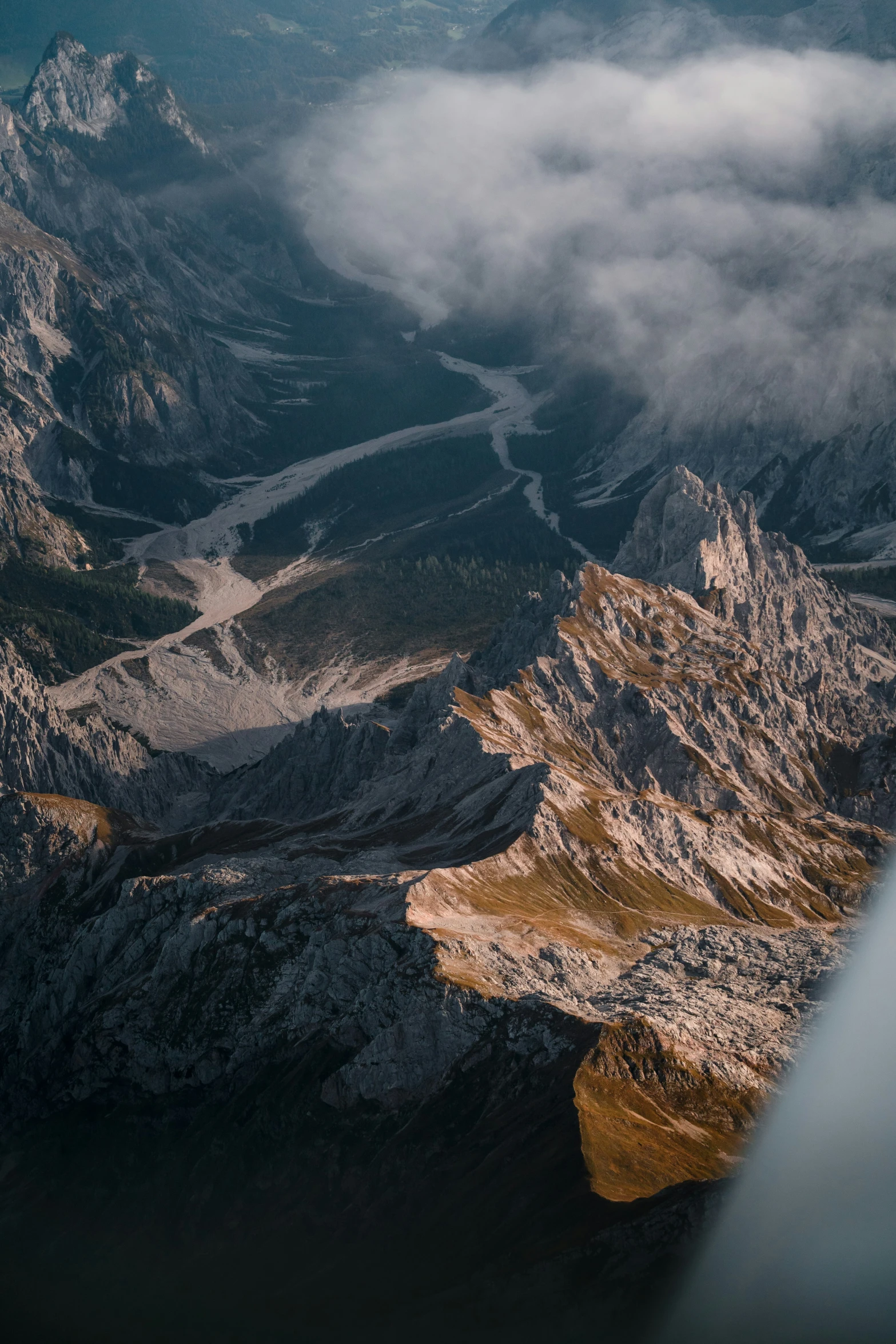 looking down at a mountain range from an airplane