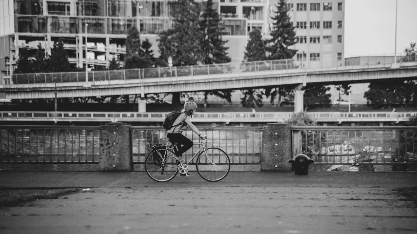 a person riding a bicycle on a city street