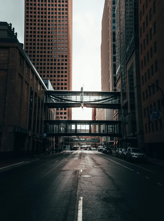 the view down an empty city street towards tall buildings