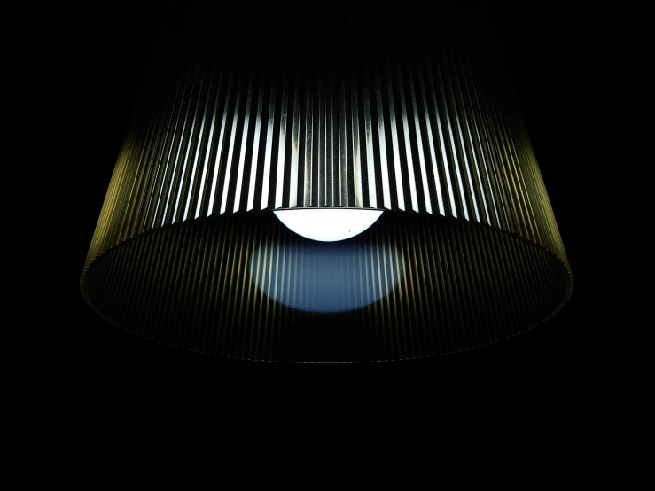 light shines on the black surface with horizontal lines