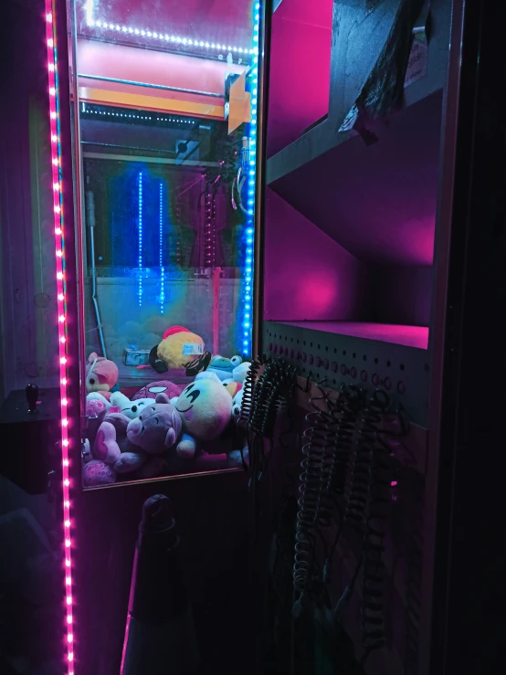 a dark room with pink and blue lights in it