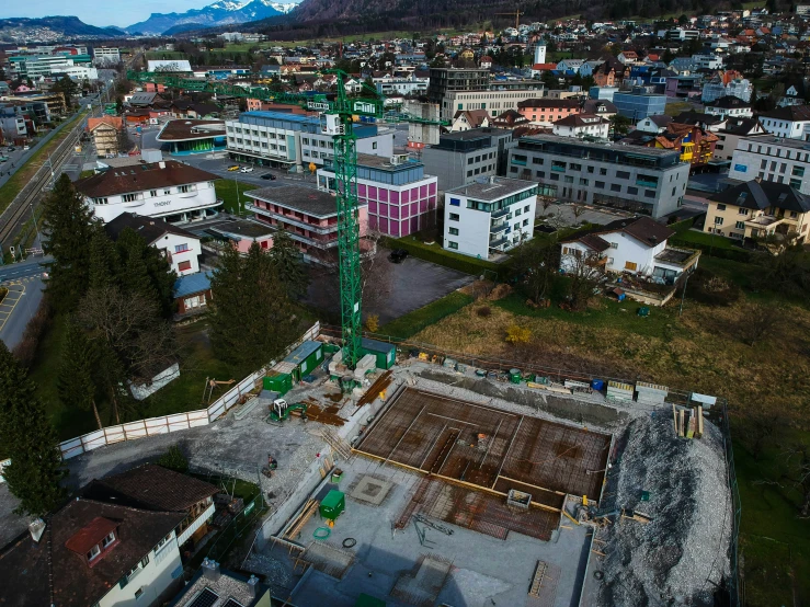 a crane stands on top of a building that is under construction