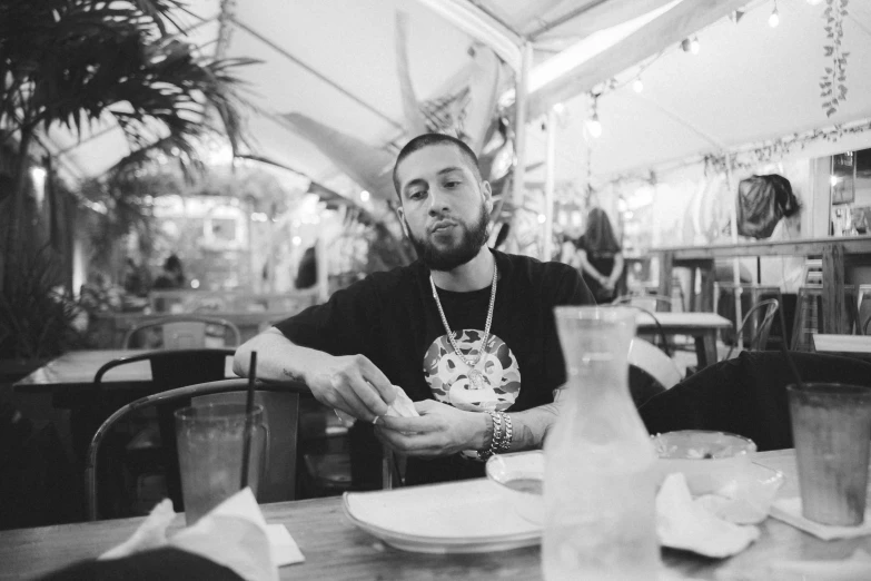 a man sitting at a table with food