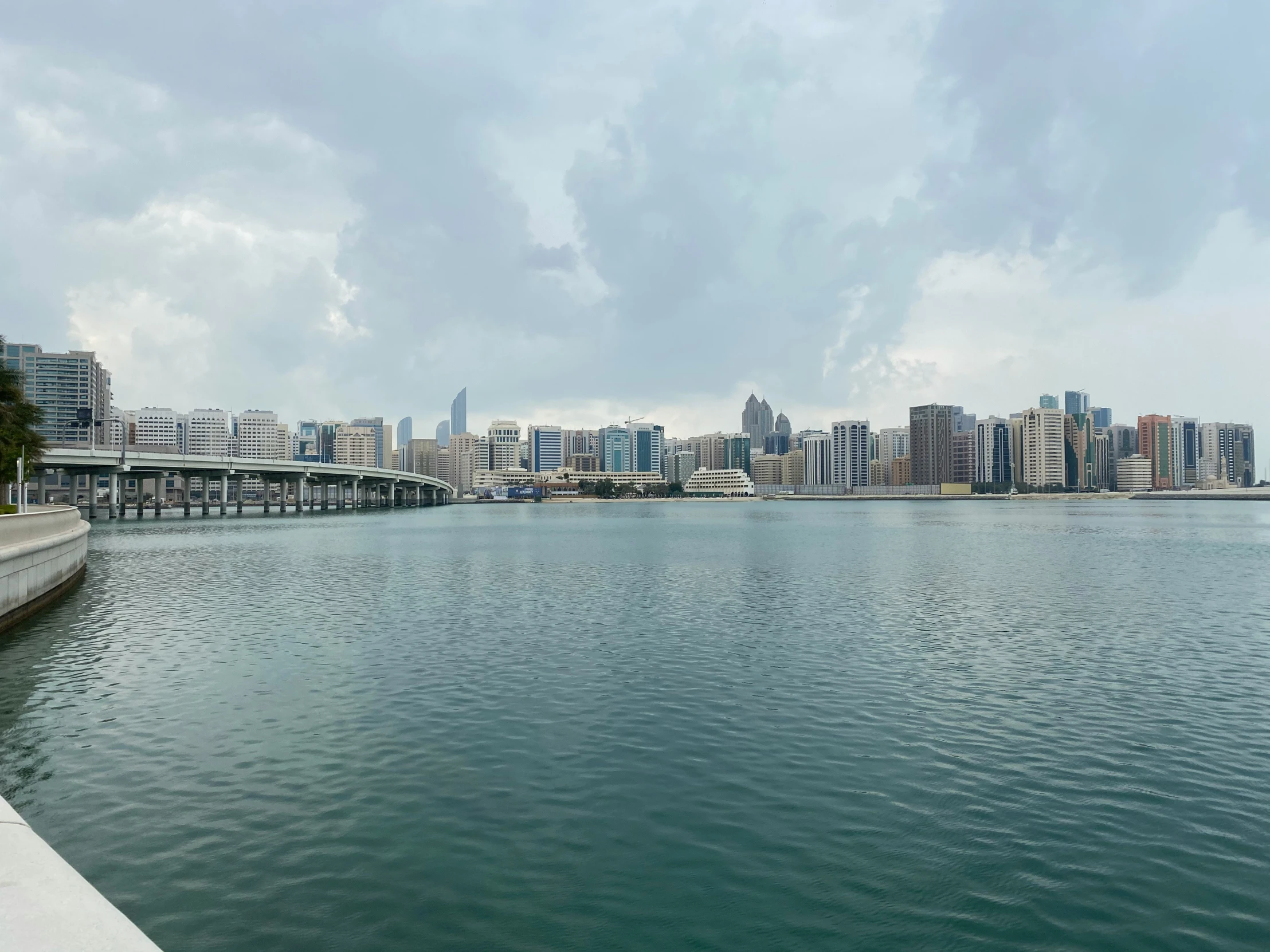 a beautiful view of the city skyline and water from the shoreline