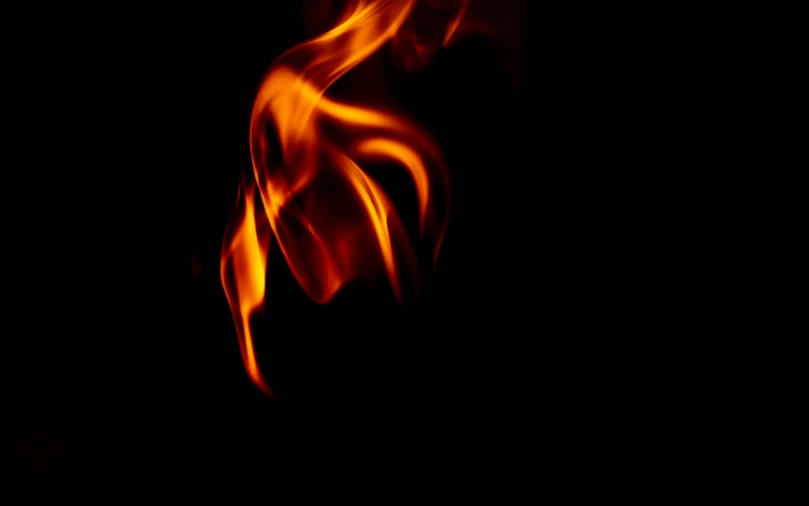 fire flowing in the air on a black background