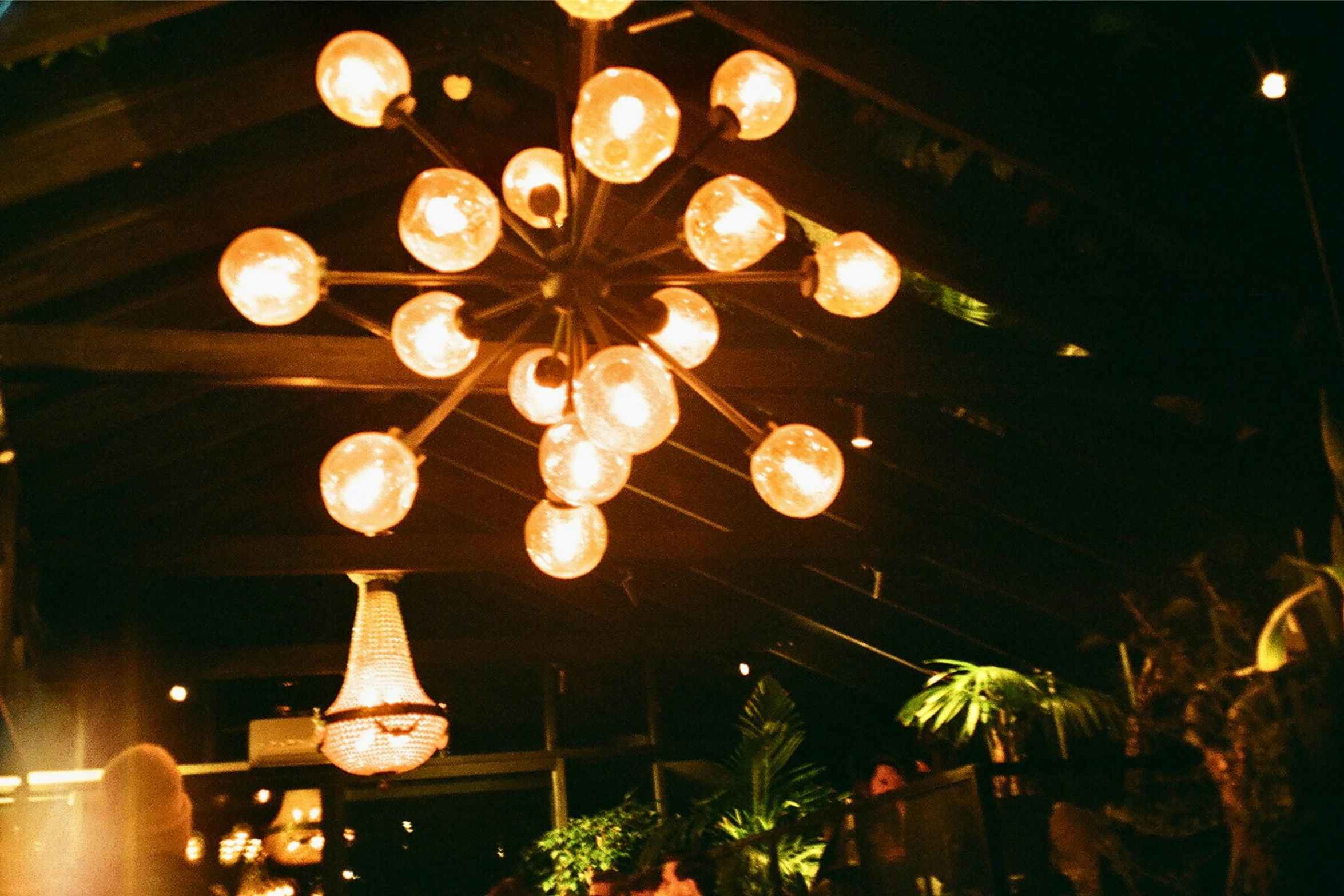 an elaborate light fixture is hanging from the ceiling