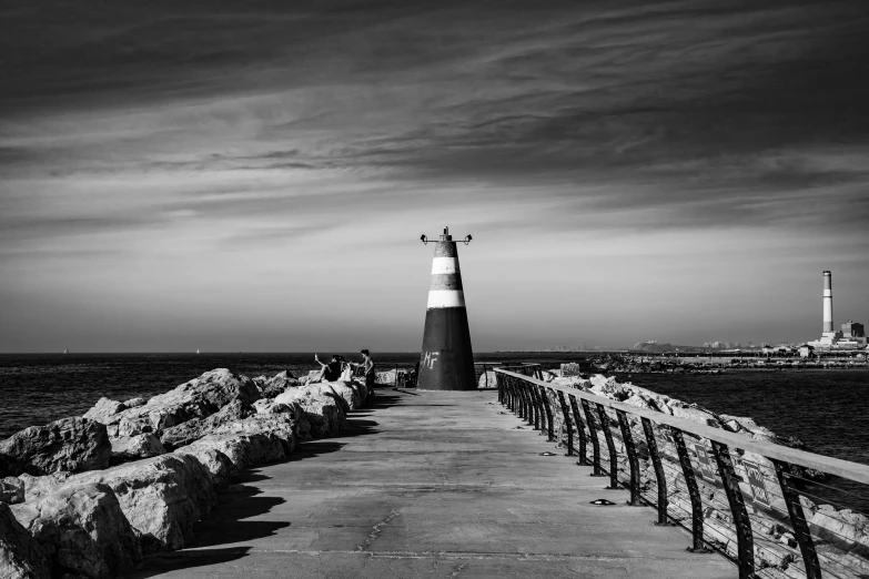 a light house that is next to the ocean