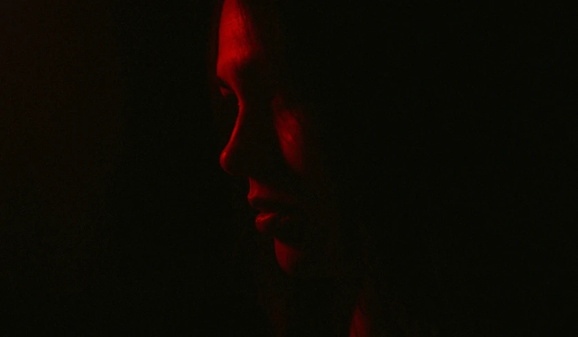 a close up of a person in the dark